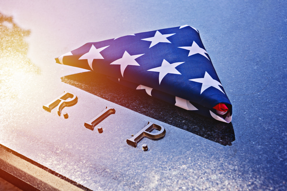 Folded American Flag on a marble memorial