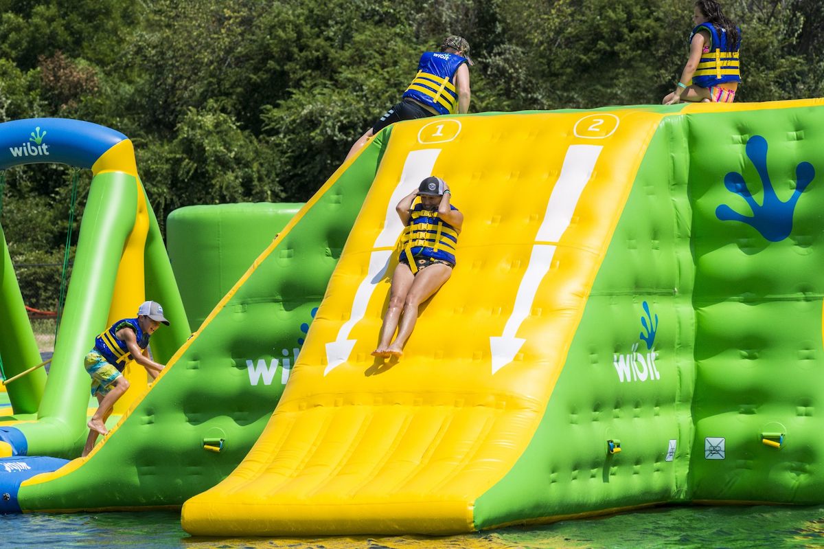 Several people on an inflatable structure floating in the water