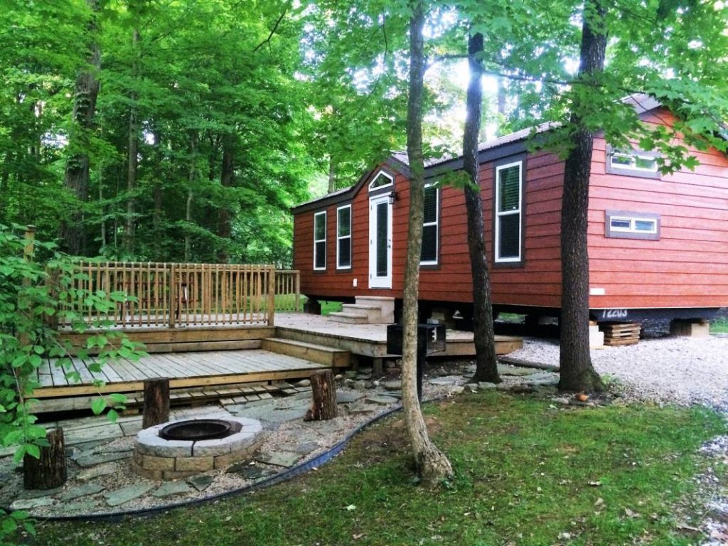 Yogi Bear Cabin Exterior with fire pit, deck, and grassy area