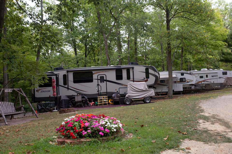 Row of detached trailers and golf cart