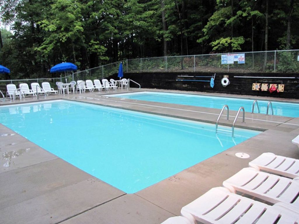 Two large pools with seating