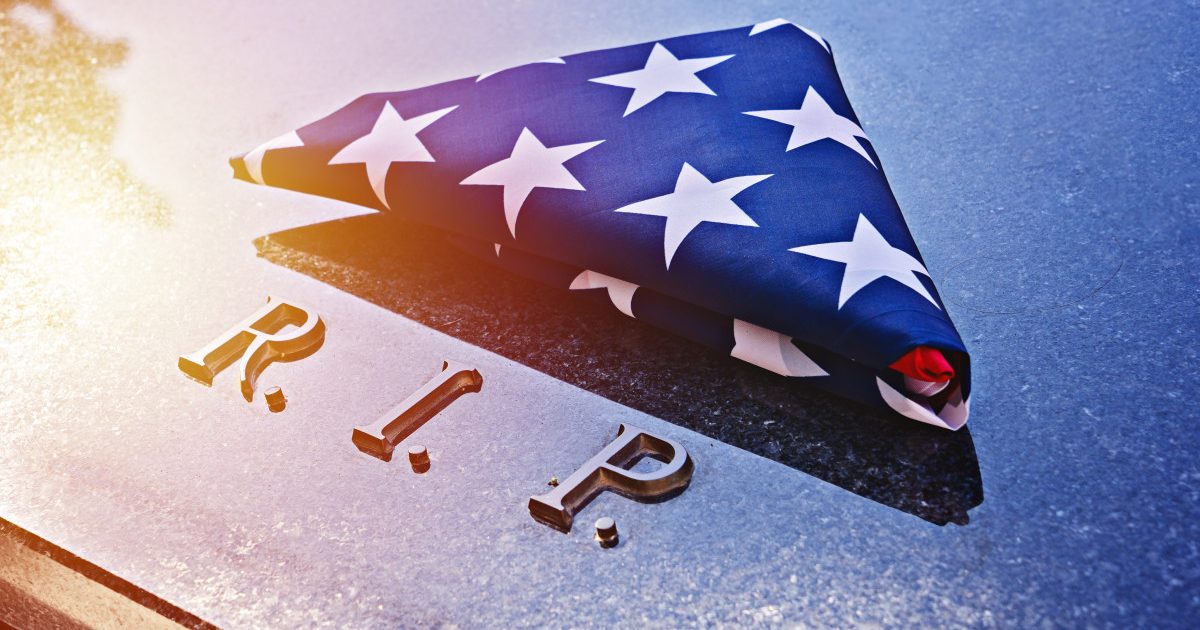 Folded American Flag on a marble memorial